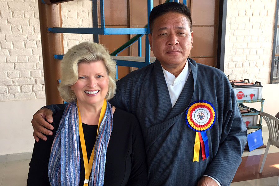At His Holiness’ palace compound with the monk who guards His Holiness’ prayer hall, which is not open to the public. Patti Bailey and Rev. Susan Sims Smith, Dharmsala, India, 2013.